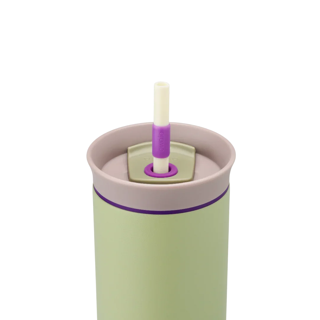 Owala green 710ml tumbler with a purple lid and straw close up shot