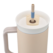 Owala stainless steel insulated tumbler with handle and straw 1185ml beige/sand base with light lid close up shot