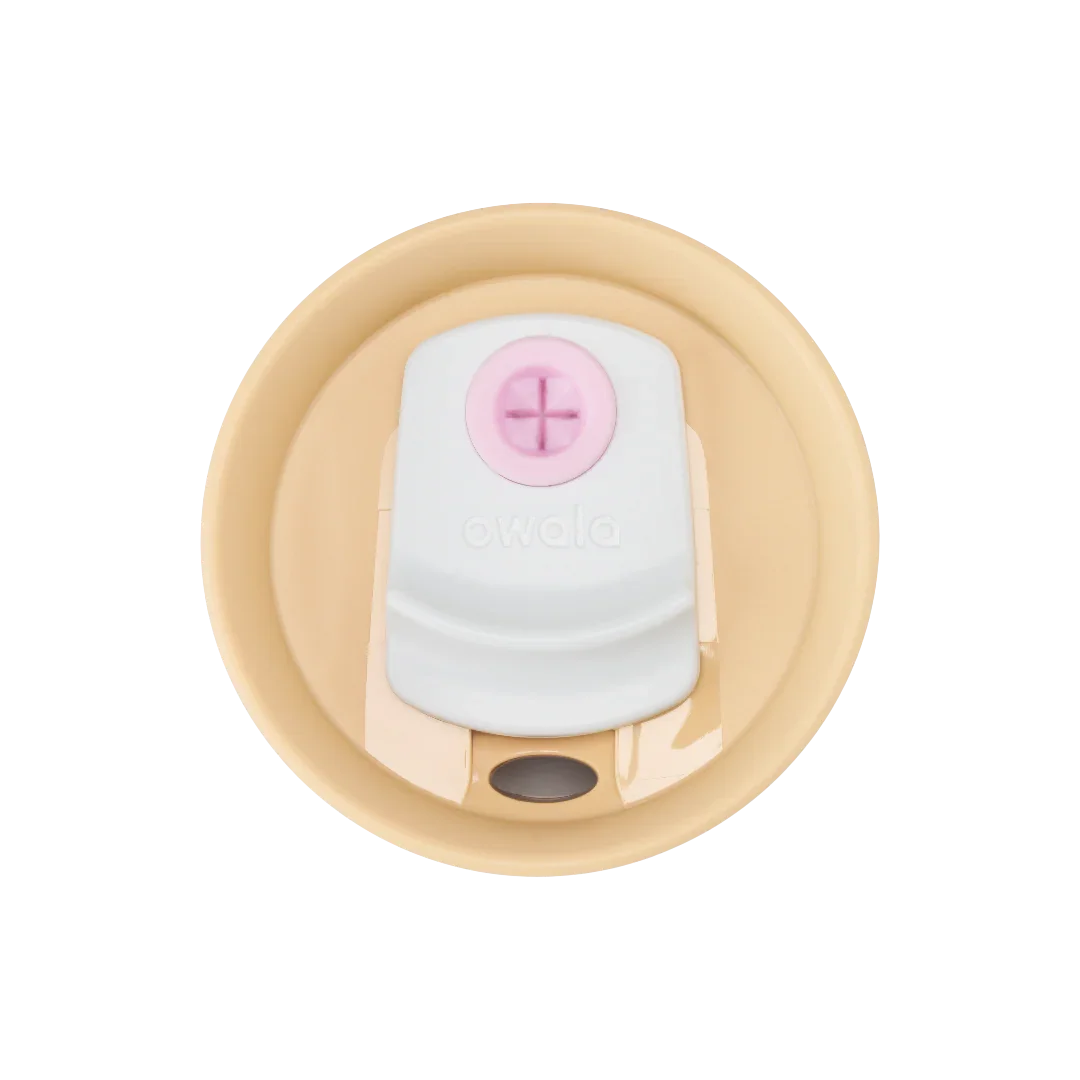 Owala purple tumbler with a beige lid and pink straw top down shot of lid