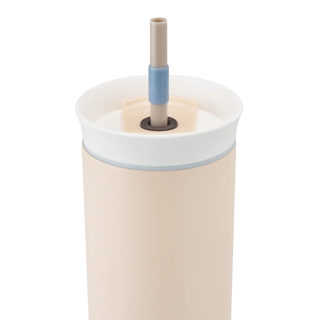 Owala beige 710ml tumbler with a white lid and straw close up shot