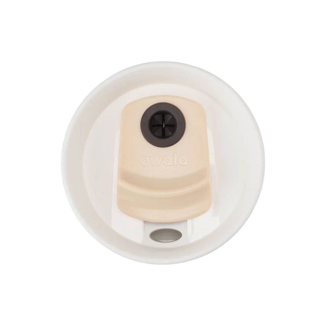 Owala beige 710ml tumbler with a white lid and straw top down shot