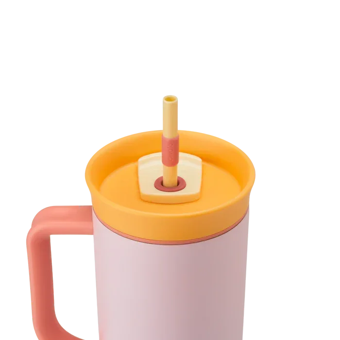 Owala stainless steel insulated tumbler with handle and straw 1185ml pink base with yellow lid close up shot