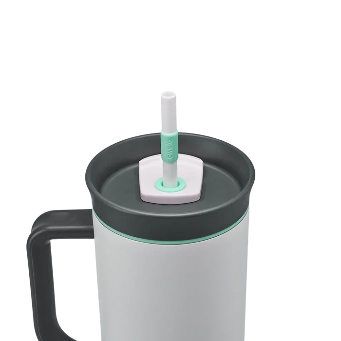 Owala stainless steel insulated tumbler with handle and straw 1185ml light base with dark lid close up shot