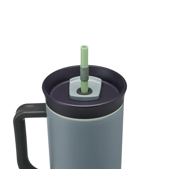 Owala stainless steel insulated tumbler with handle and straw 1185ml light blue base with dark lid close up shot