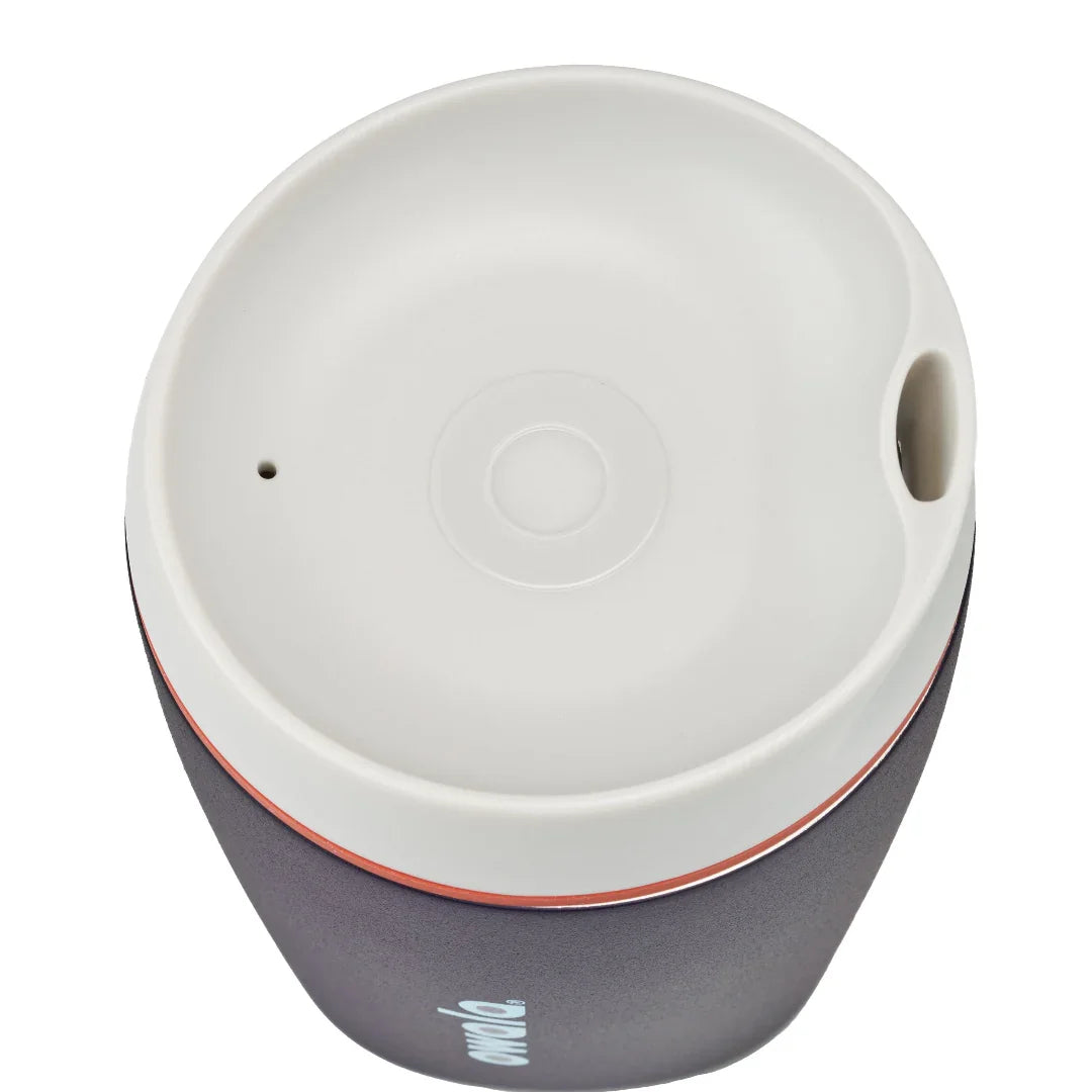 Owala smoothsip insulated stainless steel coffee cup dark base top down view with light lid on