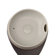 Owala smoothsip insulated stainless steel coffee cup dark base top down view with light lid on